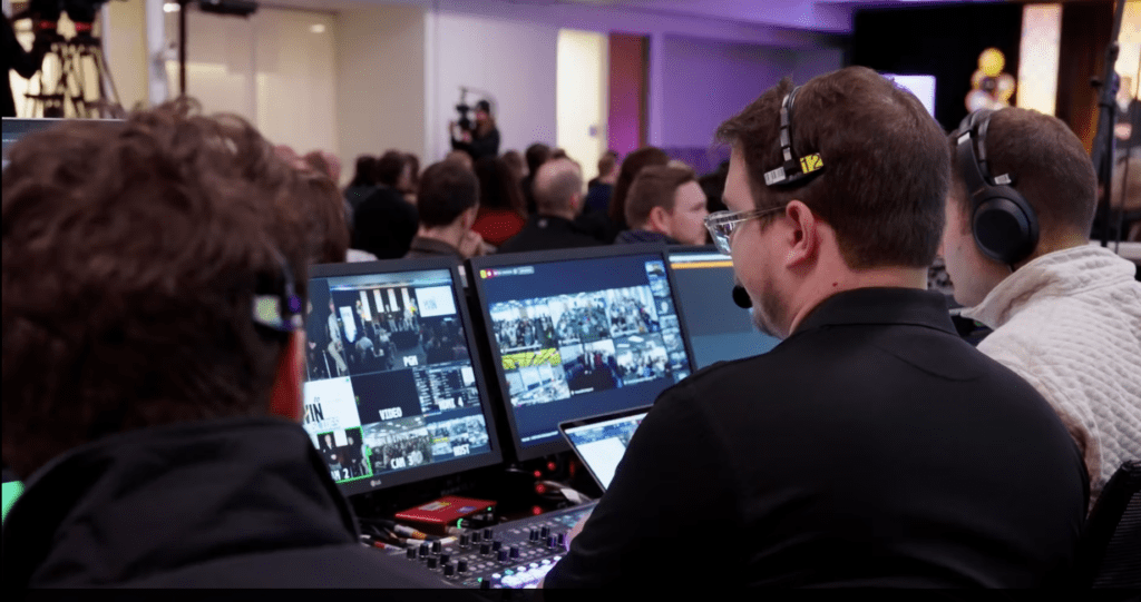 person looking at computer monitor at a livestream event